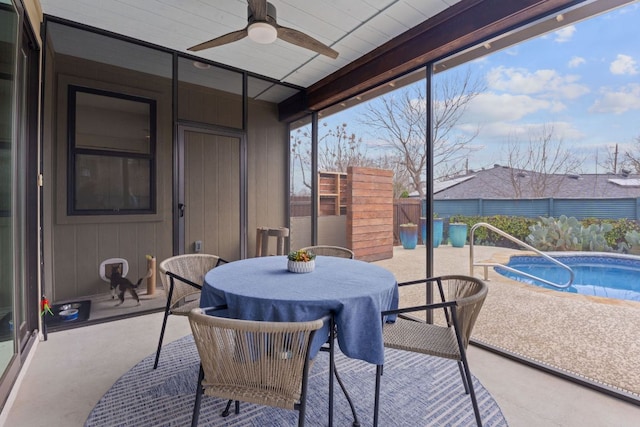 sunroom / solarium featuring ceiling fan