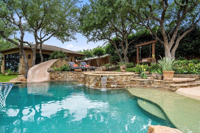 outdoor pool with a water slide and fence