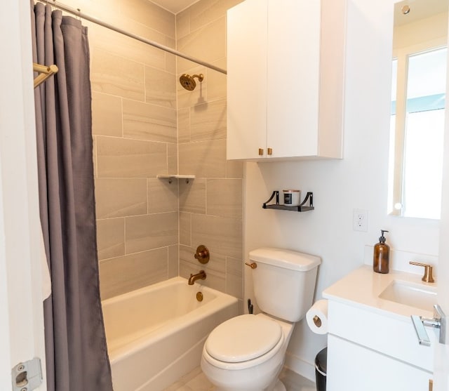 bathroom with shower / tub combo with curtain, vanity, and toilet