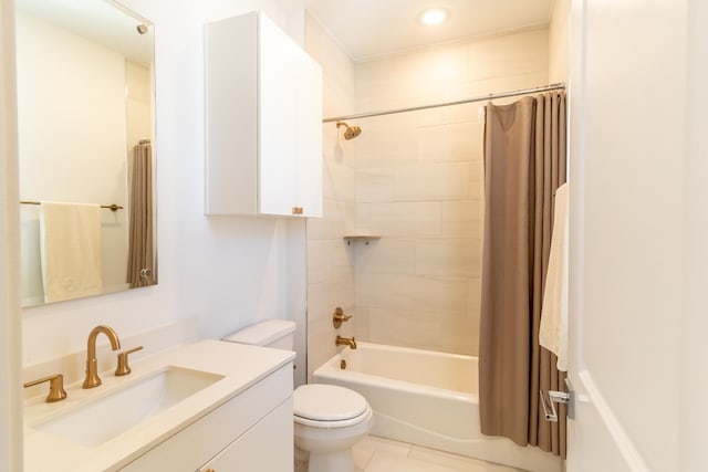 full bathroom with vanity, toilet, shower / bath combo with shower curtain, and tile patterned flooring