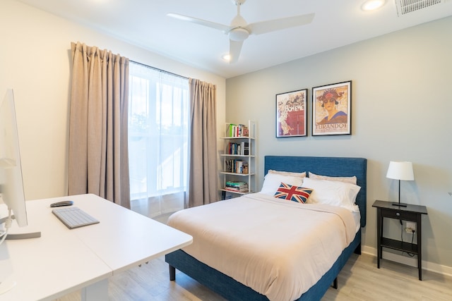 bedroom with light wood finished floors, visible vents, recessed lighting, and baseboards