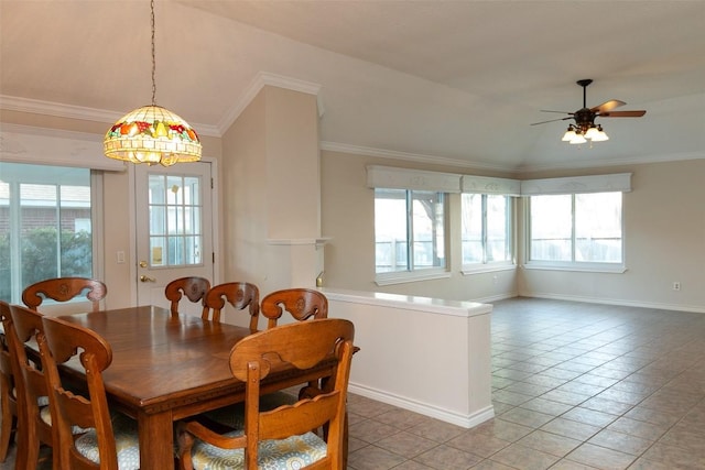 dining area with light tile patterned floors, ornamental molding, and a ceiling fan