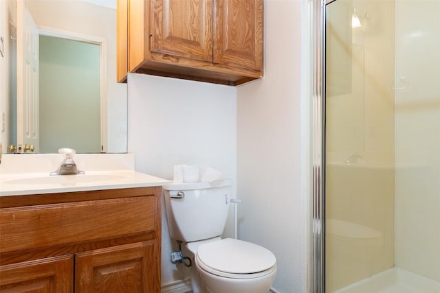 full bath featuring vanity, toilet, and a shower stall