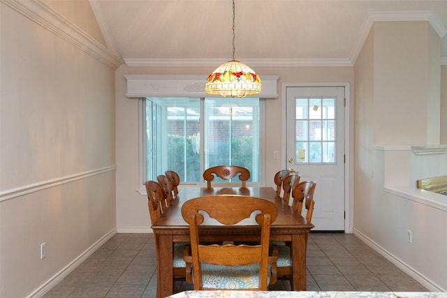 tiled dining room featuring crown molding, baseboards, and vaulted ceiling