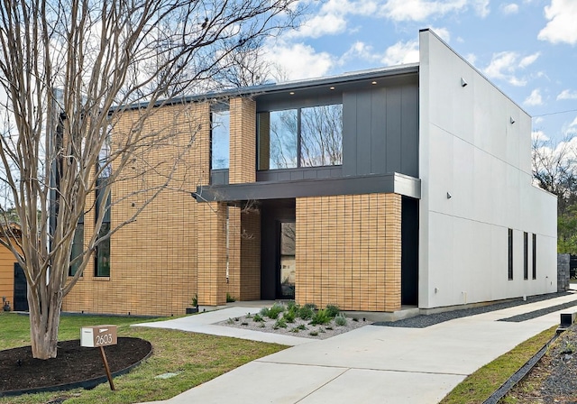 2603 Little John Ln, Austin, TX 78704 - modern home featuring brick siding and a front lawn