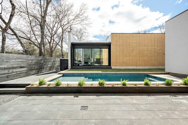 view of swimming pool with a fenced backyard and a fenced in pool