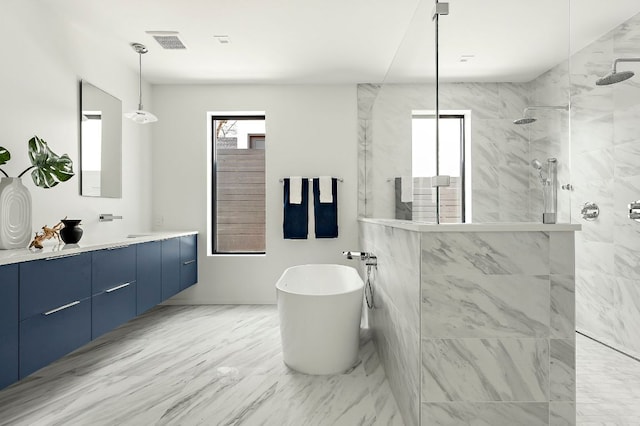 bathroom with visible vents, double vanity, a soaking tub, a walk in shower, and marble finish floor