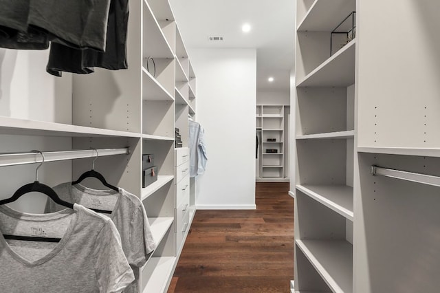 spacious closet with visible vents and dark wood-style flooring