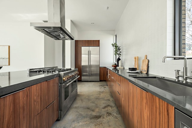 kitchen with modern cabinets, high quality appliances, island exhaust hood, concrete floors, and dark countertops