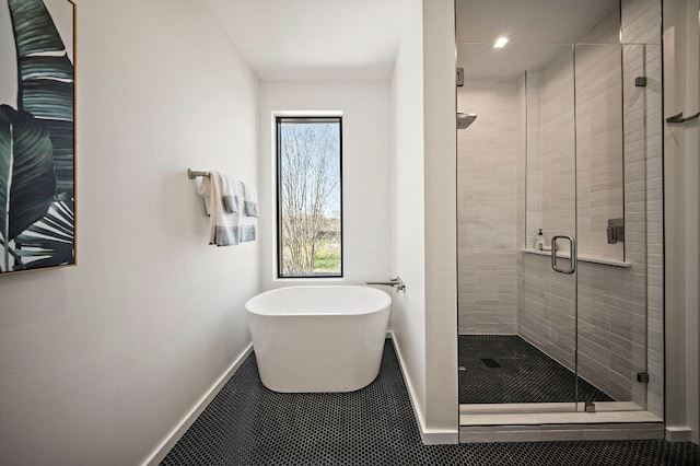 2603 Little John Ln, Austin, TX 78704 - full bathroom with a shower stall and a freestanding tub