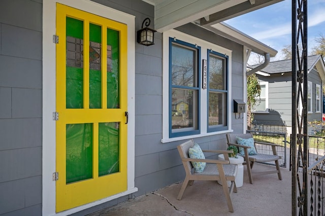 doorway to property with covered porch