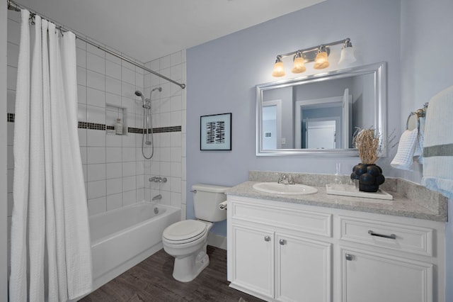 full bathroom featuring vanity, shower / tub combo, toilet, and wood finished floors