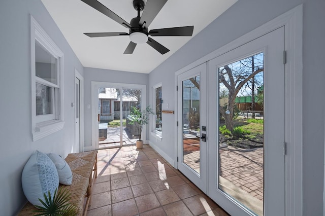 sunroom / solarium with french doors and ceiling fan