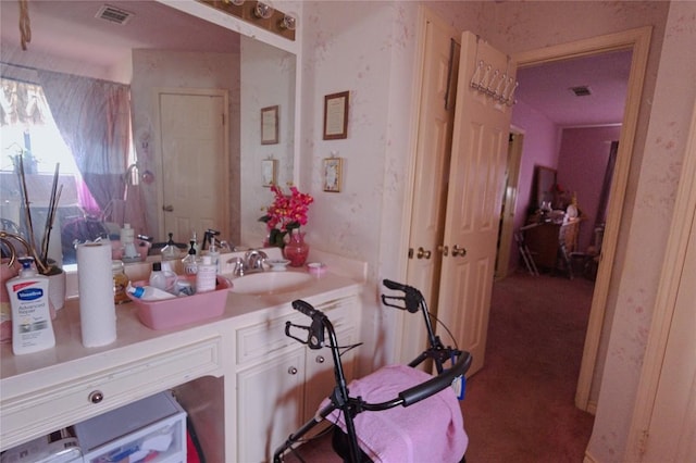 bathroom featuring visible vents and vanity