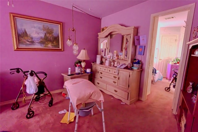 bedroom with visible vents, baseboards, and carpet