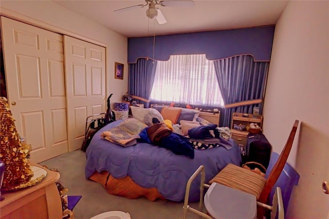 bedroom with a closet, carpet, and a ceiling fan