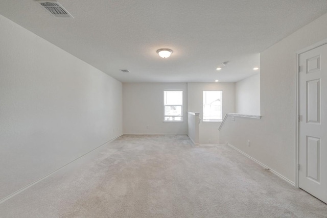 1004 Brenham Ln, Leander, TX 78641 - spare room with light carpet and recessed lighting