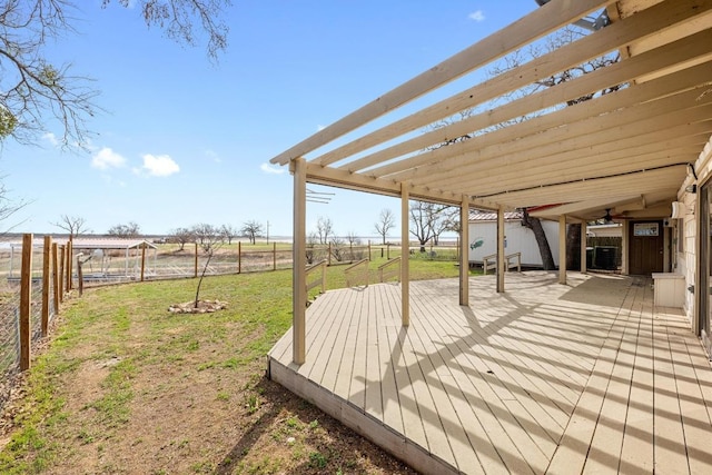 wooden terrace with a yard, a fenced backyard, and a pergola