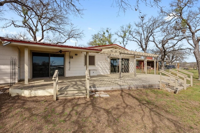 rear view of house featuring a patio area and a ceiling fan