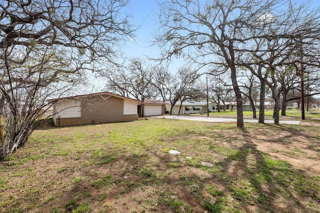 view of yard featuring an attached garage