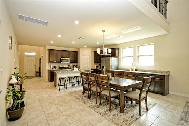 dining room with visible vents, baseboards, a chandelier, light tile patterned floors, and recessed lighting