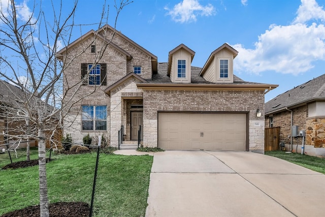 view of front of house featuring concrete driveway, an attached garage, a front lawn, and stone siding