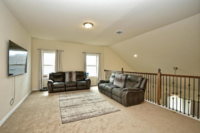 living room featuring vaulted ceiling, baseboards, visible vents, and carpet floors