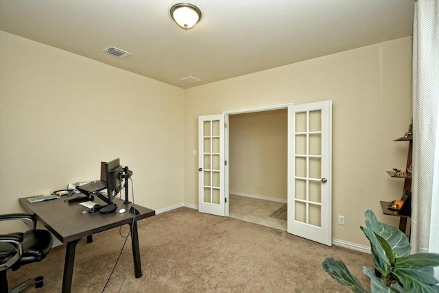 carpeted home office with french doors, visible vents, and baseboards