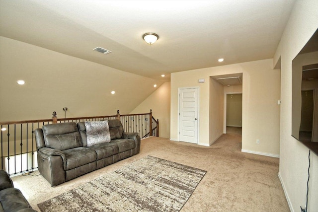 carpeted living area with recessed lighting, visible vents, baseboards, and lofted ceiling