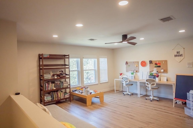 playroom with a ceiling fan, recessed lighting, wood finished floors, and visible vents