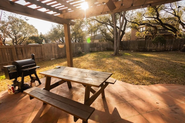 view of patio / terrace with a fenced backyard, outdoor dining space, a pergola, and grilling area