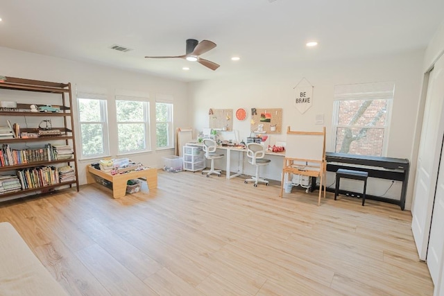 recreation room featuring wood finished floors, ceiling fan, and recessed lighting