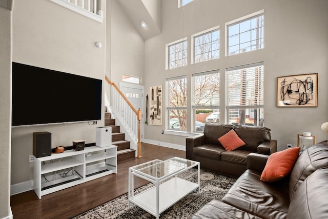 1601 Miriam Ave Unit 103, Austin, TX 78702 - living room featuring a high ceiling, wood finished floors, and stairs
