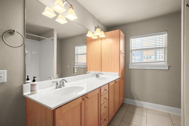 1601 Miriam Ave Unit 103, Austin, TX 78702 - bathroom with double vanity, tile patterned floors, and a shower