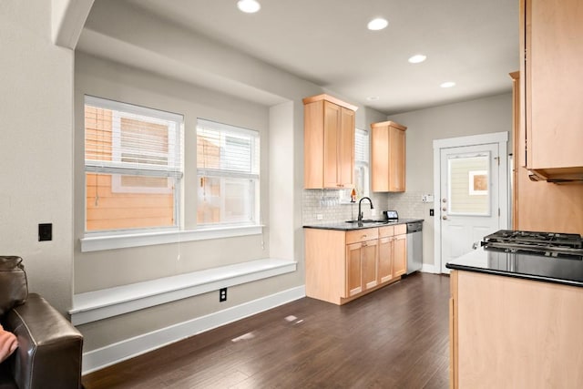 1601 Miriam Ave Unit 103, Austin, TX 78702 - kitchen featuring light brown cabinets, dark wood finished floors, recessed lighting, tasteful backsplash, and dark countertops