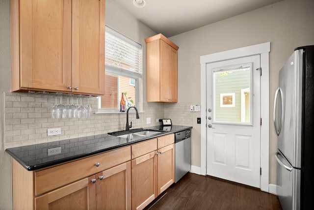 1601 Miriam Ave Unit 103, Austin, TX 78702 - kitchen with appliances with stainless steel finishes, dark wood-style floors, decorative backsplash, and light brown cabinets