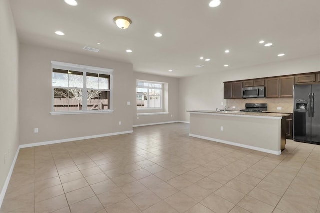 kitchen with visible vents, black appliances, tasteful backsplash, recessed lighting, and light countertops