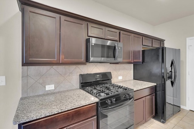 kitchen with tasteful backsplash, dark brown cabinetry, and black appliances