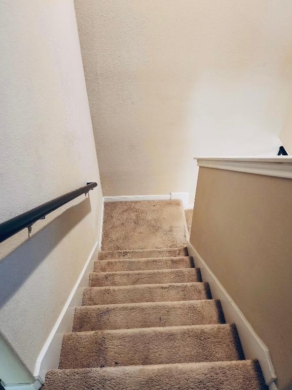 stairway with baseboards