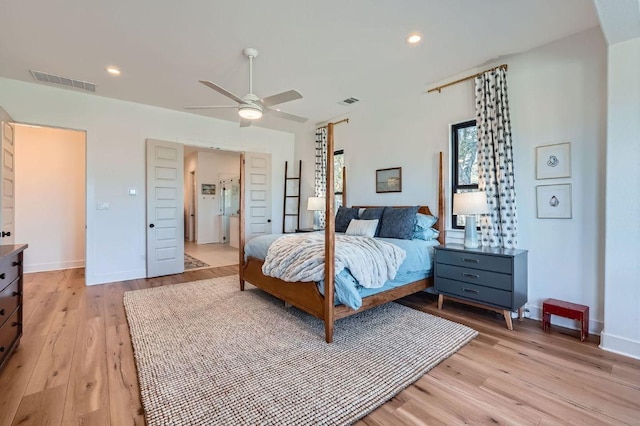 bedroom featuring light wood-type flooring, visible vents, baseboards, and recessed lighting