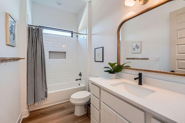 full bathroom with vanity, shower / bath combination with curtain, toilet, and wood finished floors