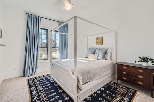 carpeted bedroom with baseboards and ceiling fan