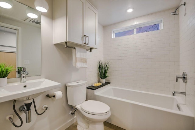 bathroom with toilet, recessed lighting, visible vents, and shower / bathtub combination