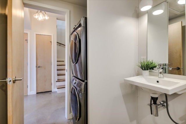 interior space with laundry area and stacked washer / dryer