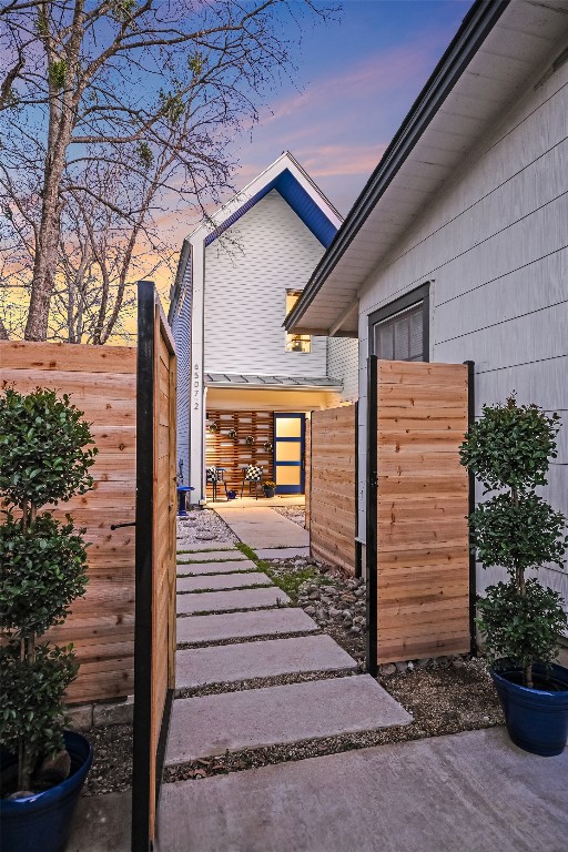 view of home's exterior featuring fence