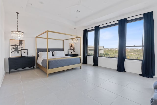 bedroom featuring light tile patterned floors, visible vents, and a chandelier