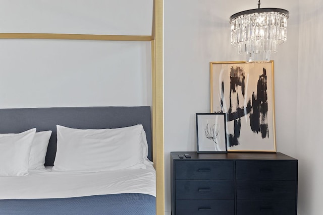 bedroom featuring an inviting chandelier