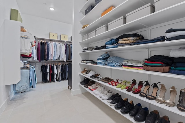 walk in closet with tile patterned flooring