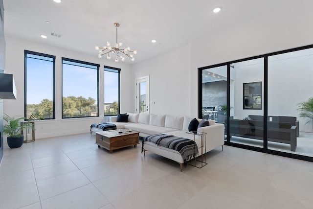 living room with recessed lighting, visible vents, a chandelier, and light tile patterned flooring