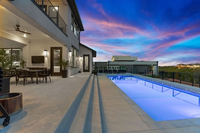 view of pool with a patio area, a fenced in pool, a ceiling fan, and fence